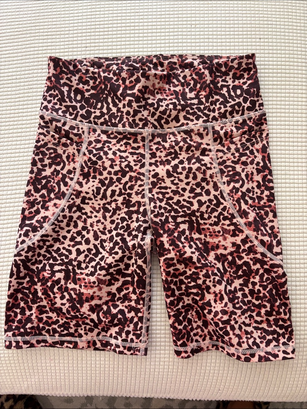 These are likely leopard print high-waisted biker shorts size medium.